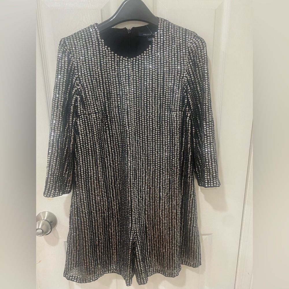 Glamorous Black and Silver 3/4 sleeve romper! Perfect for the holiday season!